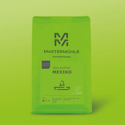 Packung Bio Kaffee Mexiko mit grünem Hintergrund.