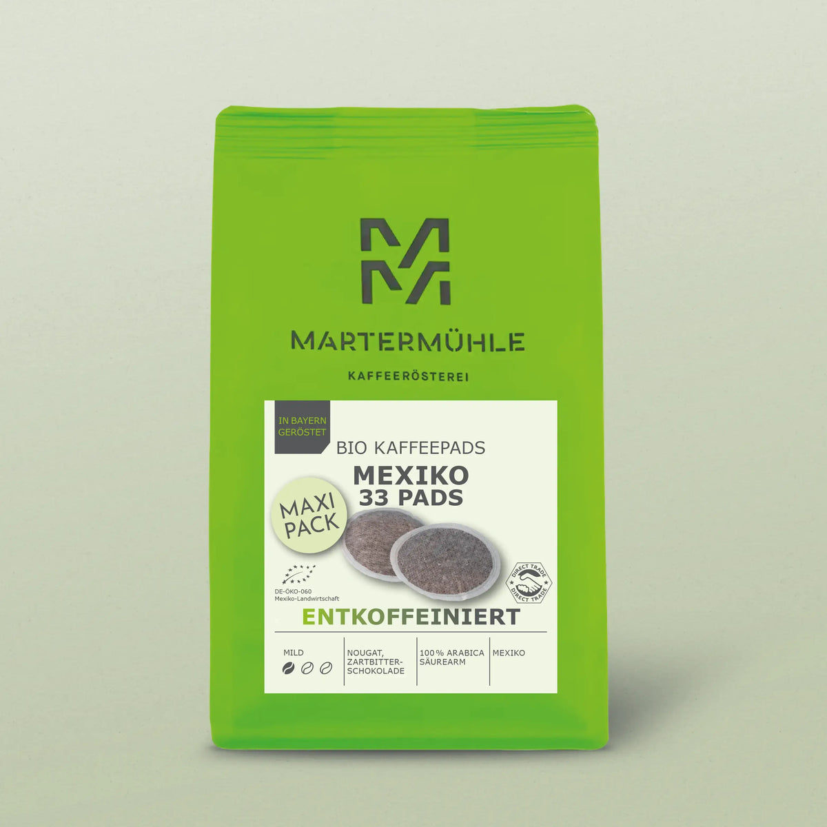 Kaffeepads Bio Kaffee Mexiko entkoffeiniert Packung vor hellgrünem Hintergrund.